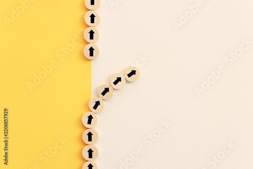 Arrows on wooden blocks, idea of thinking differently, setting goals and thinking about solution