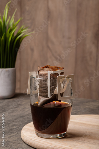 Ready Black Coffee in Mug with Used Drip Filter