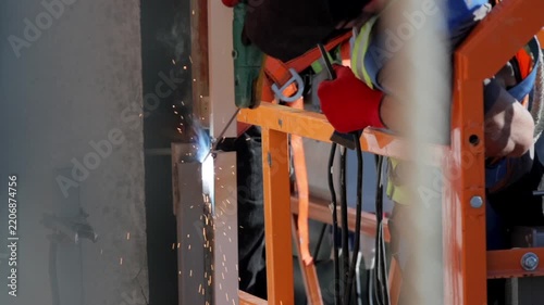 Close-up of welder arc welding metal at a construction site