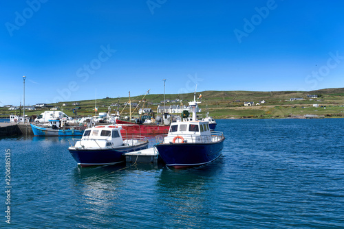 Obraz na plátně Passenger boats docked at Portmagee harbour near Skellig Islands County Kerry Ir