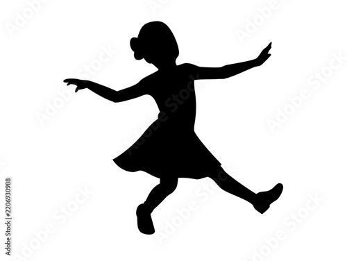 Black silhouette of a young girl dancing or spinning in a dress with silhouette spinning cheerful movement