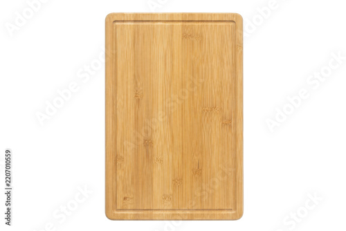Rectangular light brown bamboo cutting board with a groove, shot from a top-down perspective on a clean white background