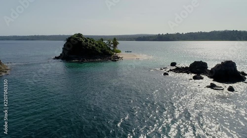 Scenic aerial view over Granito de oro Island white sand beach and turquoise waters revealing rugged coastline and open ocean, Coiba, Panama - stock video