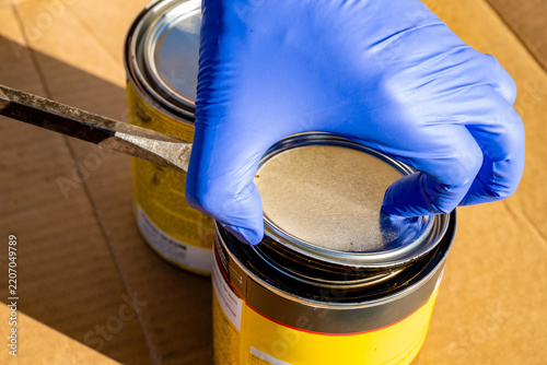 Starting a screw driver used to open a can of wood stain