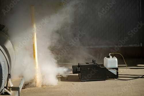 Smoke machine test outdoors filling area with fog