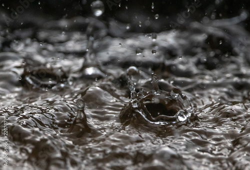 Closeup of Heavy Rain Striking Water