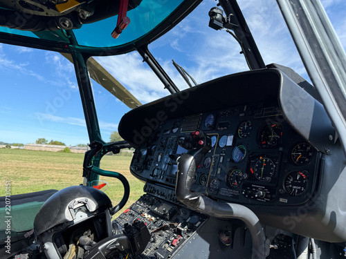 Helicopter cockpit with flight instruments and control panel
