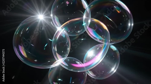 Floating Rainbow Bubbles: A cluster of iridescent soap bubbles drift and intertwine, reflecting light and casting colorful hues against a dark background. Their ephemeral beauty captivates the eye.