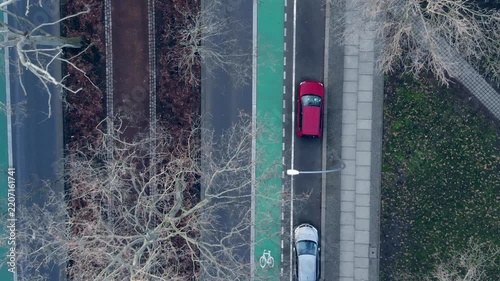 Aerial view of cars on a street with a bike lane