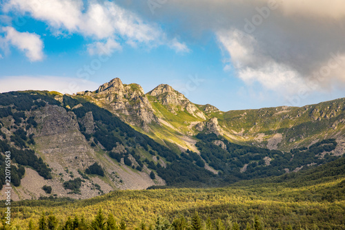view from Fivizzano to mountains of Appenines,  peaks form part of the Northern Apennines - Appennino Tosco-Emiliano. View frames the rugged limestone formations near the Passo del Cerreto.