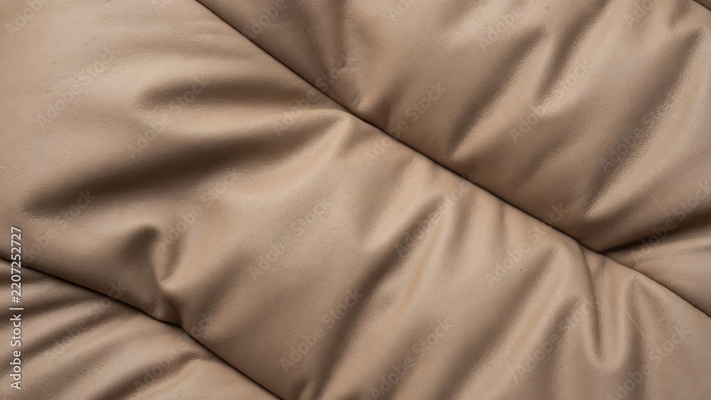 Fototapeta premium Close up macro of beige quilted soft fabric texture