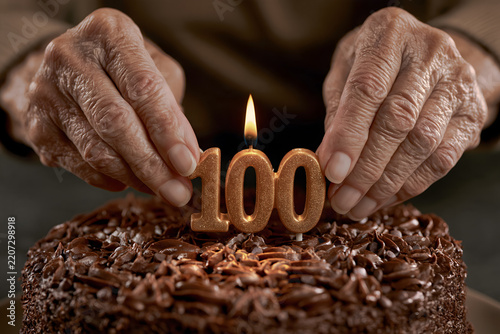 An extreme close-up of elderly hands carefully placing a single 