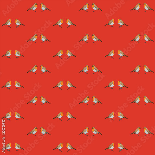 Seamless pattern created from two robins facing each other on a red background