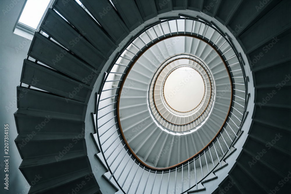 Fototapeta premium Low angle view of spiral staircase and handrail