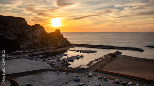 Buggerru village at sunset, aeral view, Sardinia, Italy