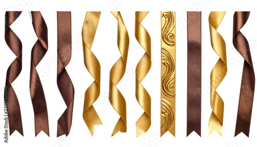 Collection of elegant gold and brown satin ribbons with various curly and straight shapes isolated on white background