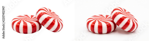 Obraz na plátně Two red and white striped peppermint candies leaning together with a glossy fini