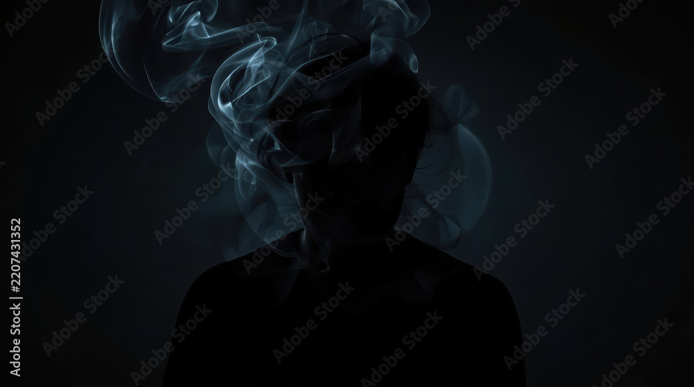 Obraz premium Abstract black smoke forming human silhouette with mysterious emotion