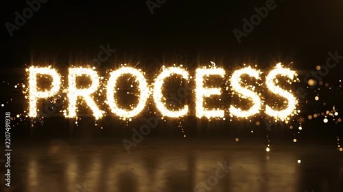 The word PROCESS illuminated with sparkling golden glitter effect on a dark reflective background.