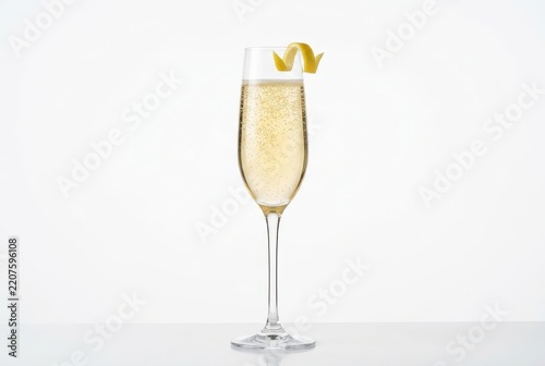 Elegant Champagne Flute with Sparkling Wine and Lemon Twist Garnish Isolated on White Background for Celebration