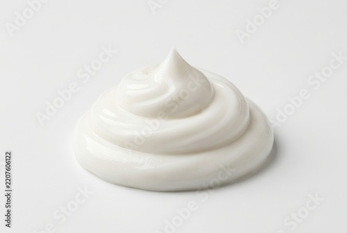 Swirl of White Cosmetic Cream or Moisturizer Isolated on Plain White Background for Skincare Beauty Concept