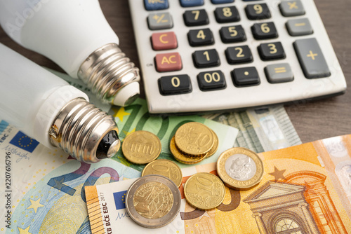 Cost of electric utilities with light bulb for payment.