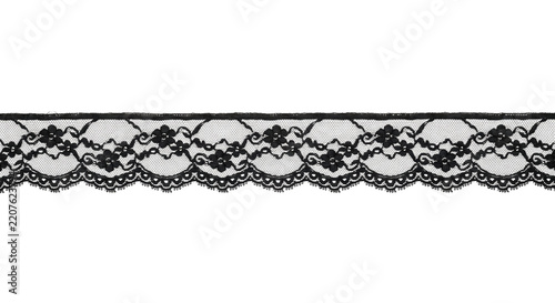Elegant black lace trim with intricate floral patterns and delicate scalloped edges, isolated on a clean white background