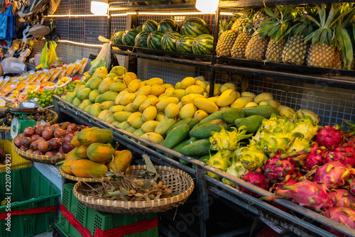 A Vibrant Display of Fresh Fruits in a Colorful Market Setting Showcasing a Variety of Tropical Produce and Baskets Overflowing with Natural Delights