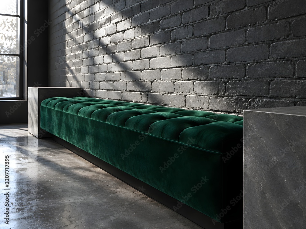 Obraz premium Grey painted brick wall behind a long tufted bench in emerald velvet with plain stone plinths at each end