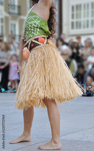 Dancers performing and wearing traditional folk costumes from Guam Island