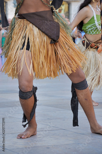 Dancers performing and wearing traditional folk costumes from Guam Island