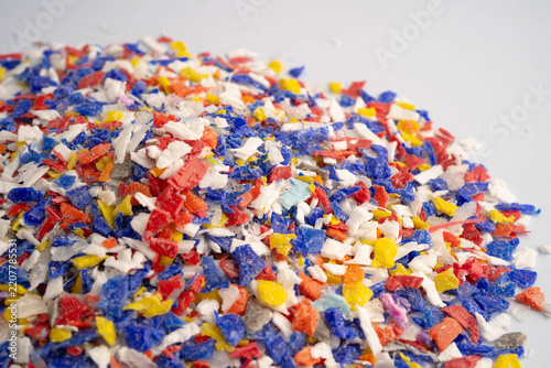 Plastic colorful pieces recycling shredded for industrial use.