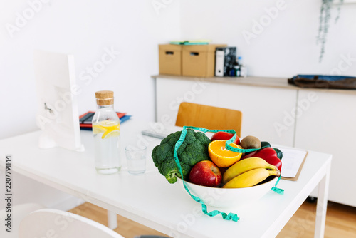 Healthy food prepared for diet consultation in clinic. Fresh fruit and vegetable ingredients support wellness planning. Nutrition and healthcare concept.