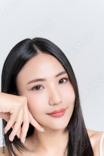 Close up of beautiful young Asian woman with healthy face skin, natural makeup and black hair. for advertising beauty makeup, skincare and self care concept.