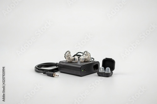 Live sound engineer's in-ear monitor pack and earpieces