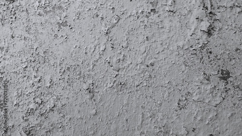 Fotografie Monochrome weathered wall featuring large areas of peeling white paint, exposed concrete and scattered holes, creating a bold distressed grunge texture