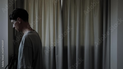 Worried man pacing at home while overthinking difficult problem