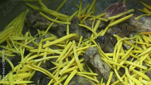 Close-Up of Kazan for Plov with Meat and Sliced Yellow Carrots