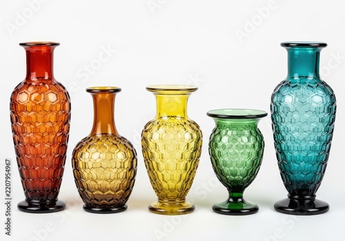 Set of five colorful textured glass vases with honeycomb pattern in a row on white background