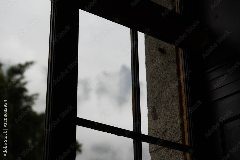 Obraz premium view from window mountain panorama with rural houses window of room