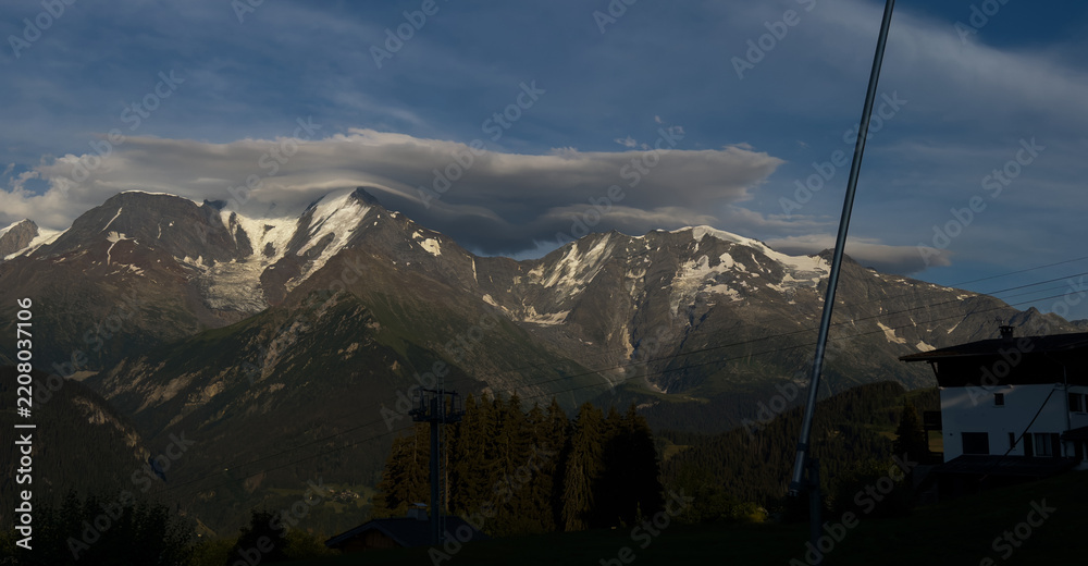 Obraz premium Summer view of the Mont Blanc massif above forested slopes 