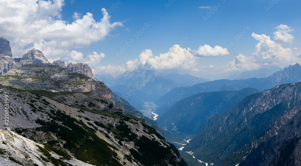Obraz premium Mountain landscape panorama Tre Cime Mount against a blue summer background. 