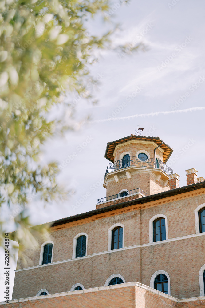 Fototapeta premium Historic Tuscan villa with octagonal tower and arched windows