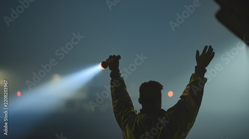 person signaling with flashlight in foggy environment