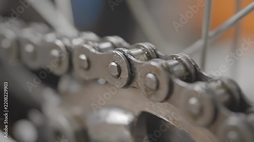 Bicycle Chain Rotating Smoothly in Close-Up 4k Footage, Showcasing Intricate Mechanical Details and a Seamless Looping Motion.