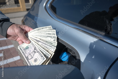 High fuel prices, US dollars. Drivers incur high costs for driving.

