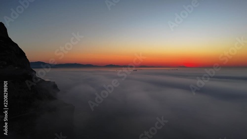 Aerial view of Europa Point at sunset with thick fog covering the sea Gibraltar, Gibraltar.