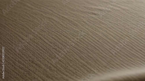 Brown Ribbed Fabric Texture with Soft Folds in Warm Lighting