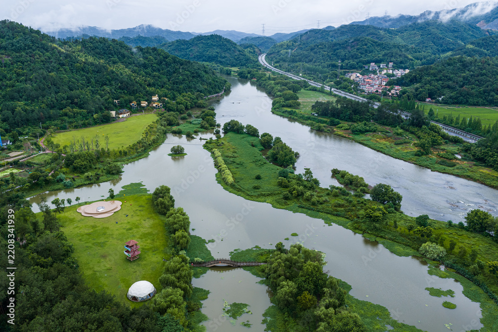 Obraz premium Aerial View of Lush Green River Valley and Wetlands in Rural China