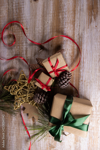 Christmas presents and other small gifts on a wooden base